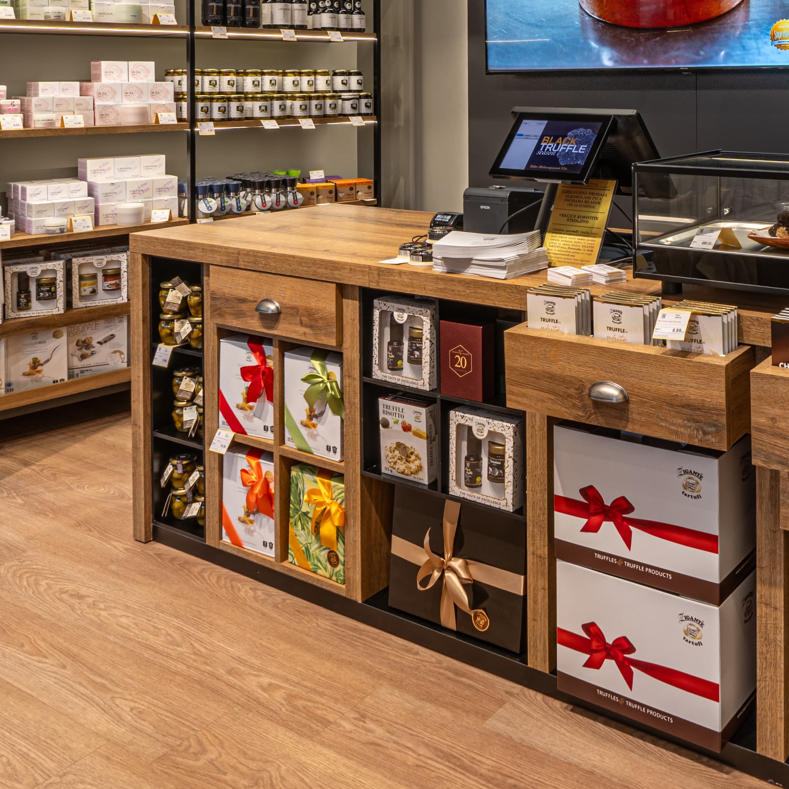 Truffle gift boxes and gourmet products displayed inside Zigante Tartufi truffle shop in Buje, Istria, Croatia