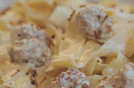 Fettucine in alfredo sauce with meatballs and black truffles