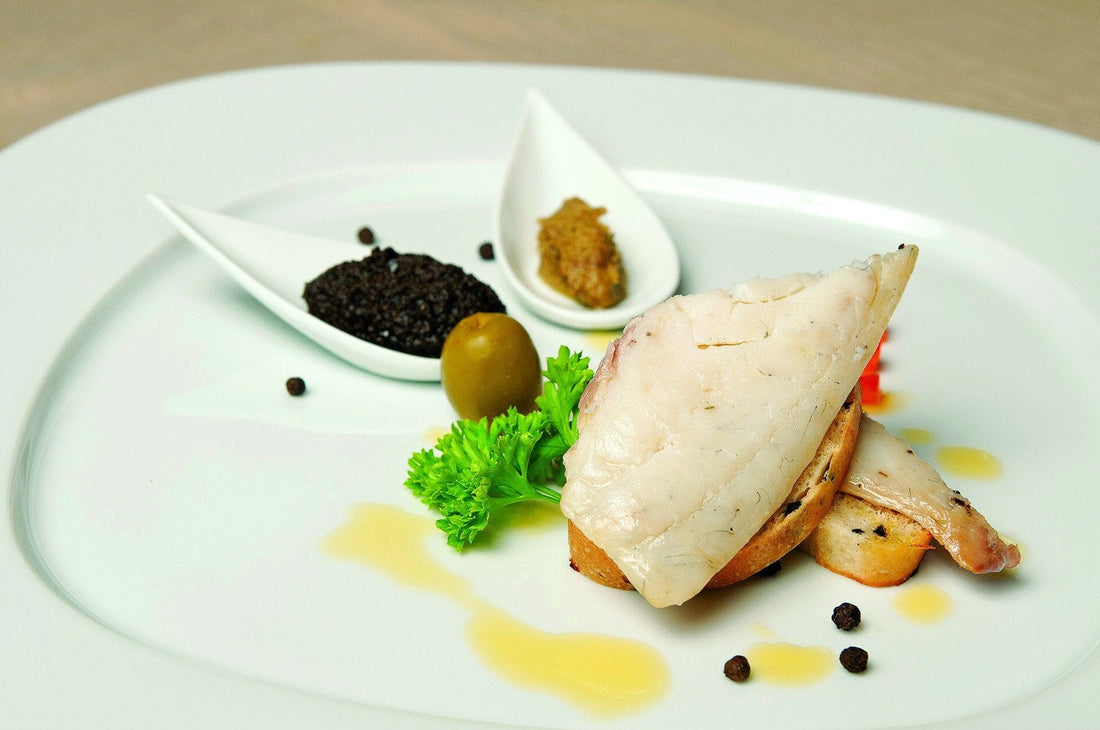 Fish filet in green olives & rosemary sauce