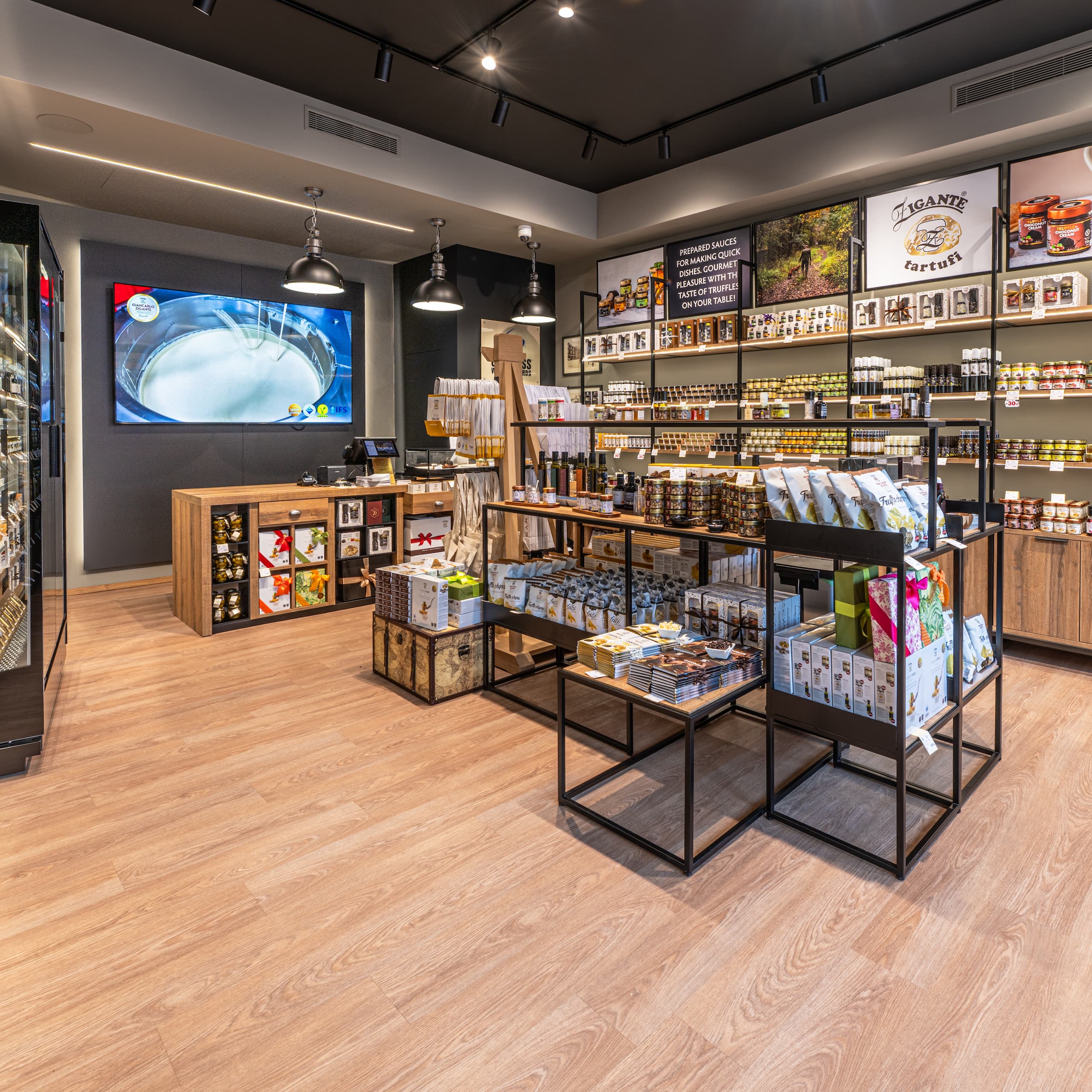 Zigante Tartufi truffle shop interior in Buje, Istria, Croatia, with shelves of truffle products and gourmet gifts.